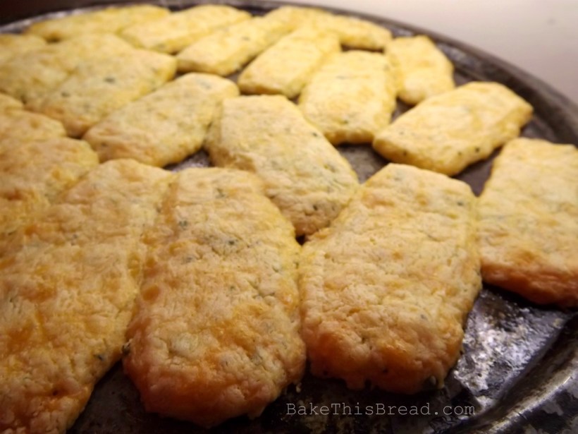 Homemade cheese puffs recipe baking on a pizza pan Bake This Bread