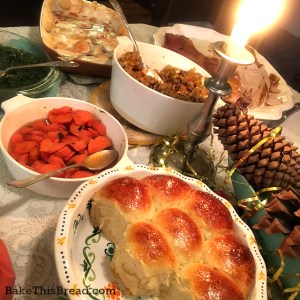 Fluffy Yeasted Buttermilk Dinner Rolls on the holiday table by bake this bread