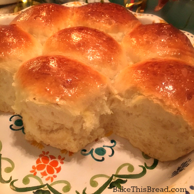 Yeasted homemade buttermilk rolls served from the ceramic baking dish by bake this bread